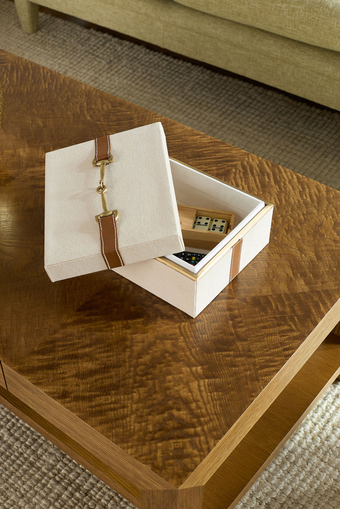 Open jewelry box with accessories on a wooden coffee table