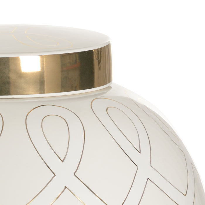 Close-up of a white vase with gold geometric patterns on a white background