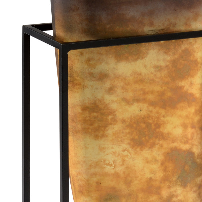 Rustic metal planter with black metal frame on a white background