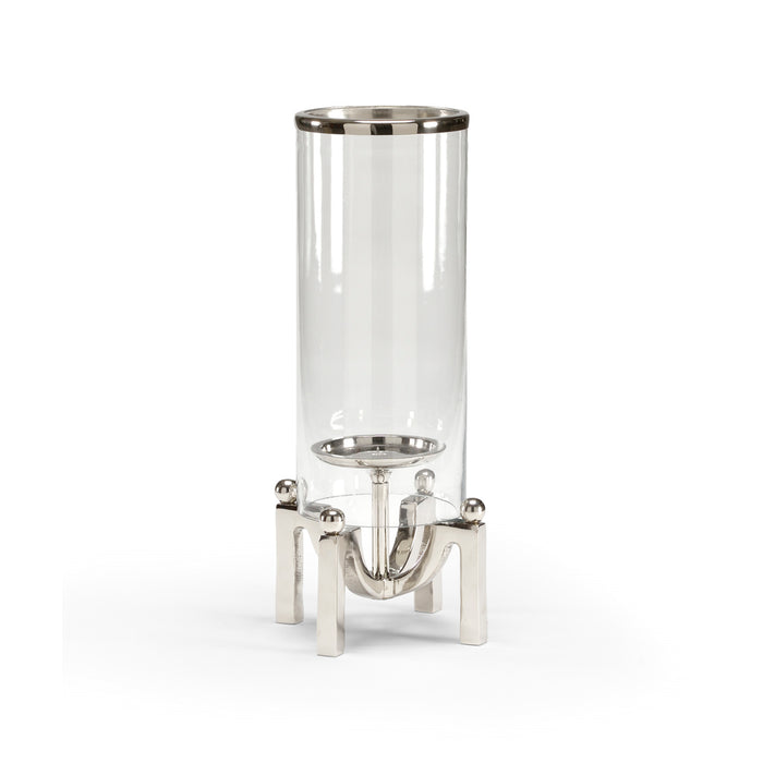 Clear glass container with metal stand on a white background