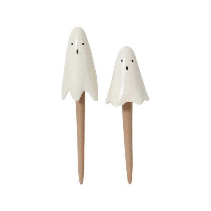 Two ghost-shaped salt and pepper shakers on a white background