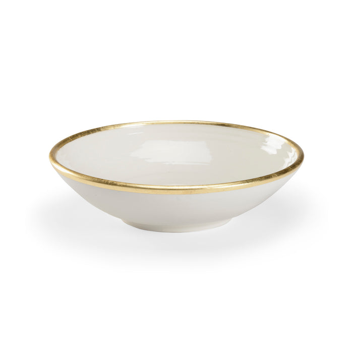 White bowl with gold rim on a white background