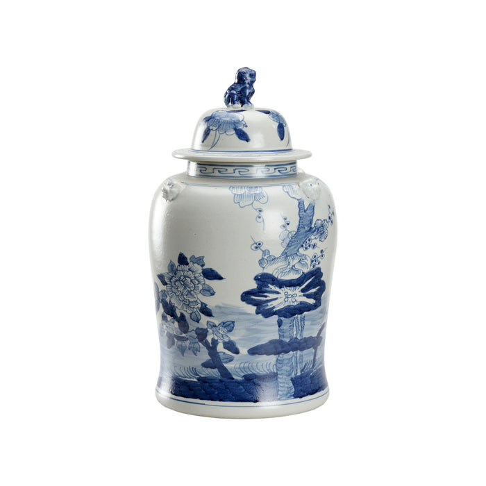 White ceramic jar with blue floral patterns and a lid on a white background
