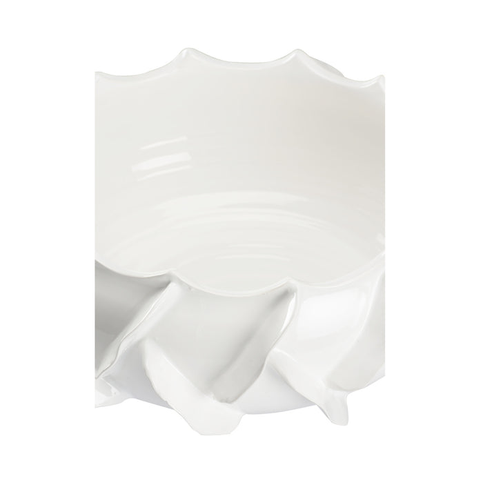 White ceramic vase with ruffled design on a white background