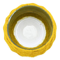 Close-up of a yellow textured object on a white background