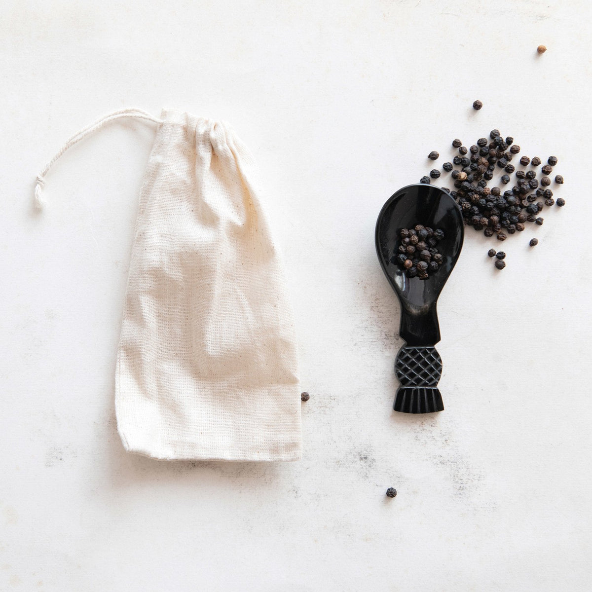 Design Shop Hand-Carved Horn Spoon in Printed Drawstring Bag