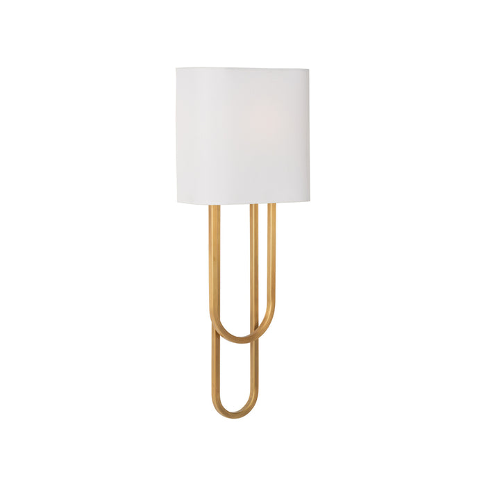 Lamp with white shade and gold base on a white background