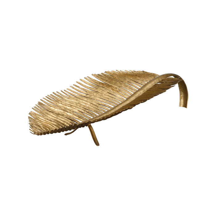 Decorative leaf-shaped object made of gold metal on a white background