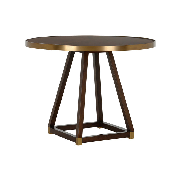 Round table with brass top and wooden legs on a white background