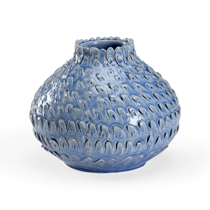 Blue textured vase on a white background