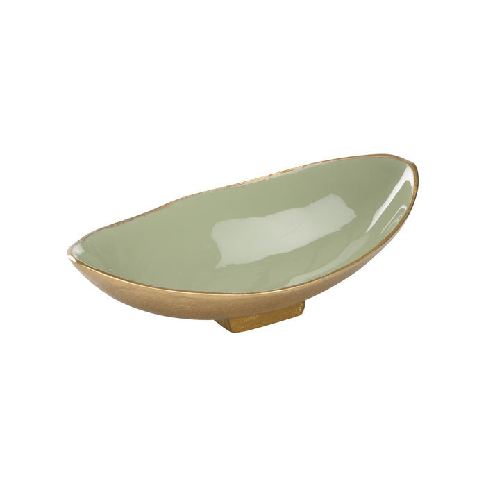 Green ceramic dish with gold rim on a white background
