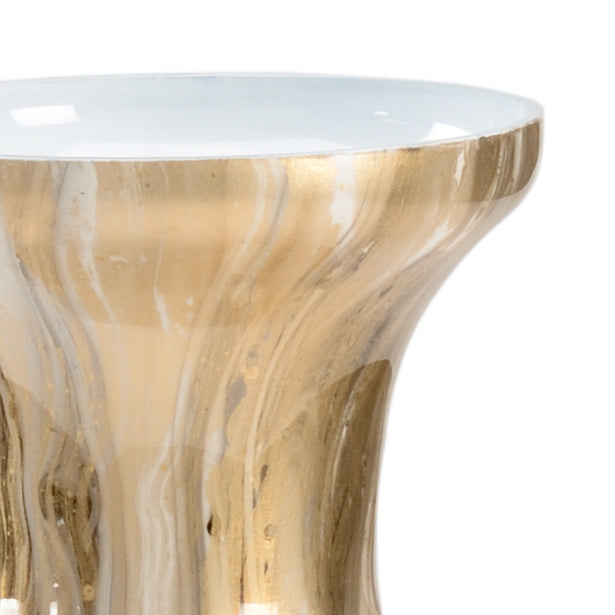 Gold and white marbled side table with a clear glass top on a white background