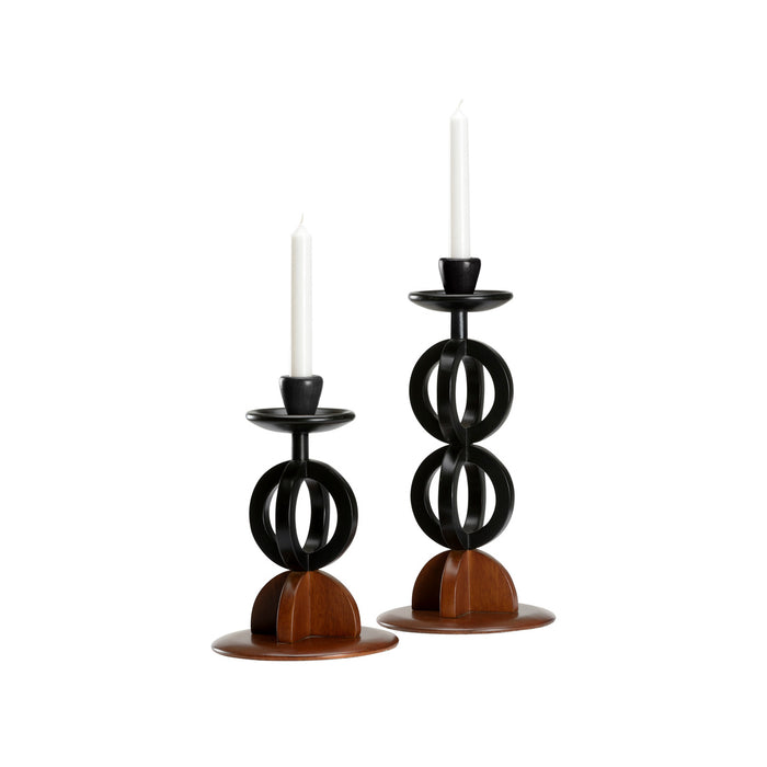 Two black and wooden candle holders with candles on a white background