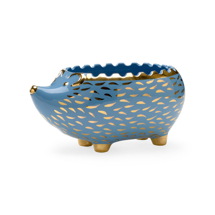 Blue ceramic bowl with gold patterns on a white background