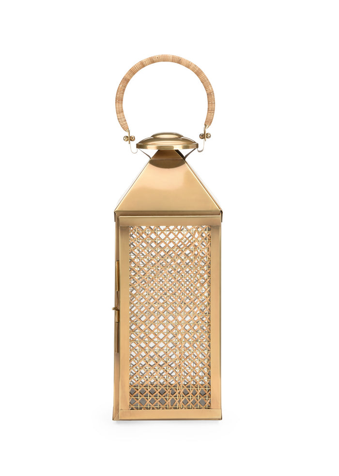 Gold lantern with intricate design on a white background