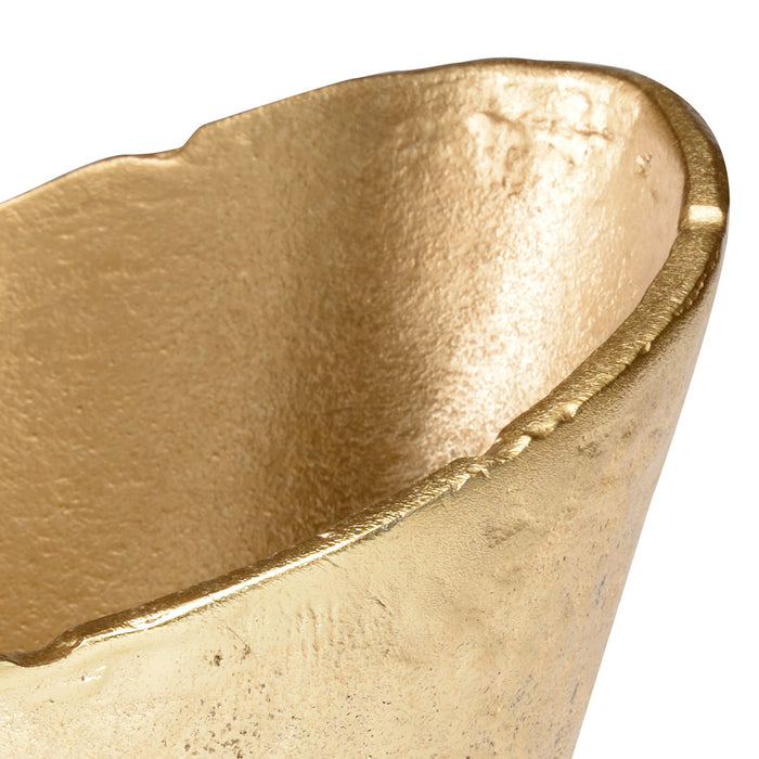Close-up of a gold ingot on a white background