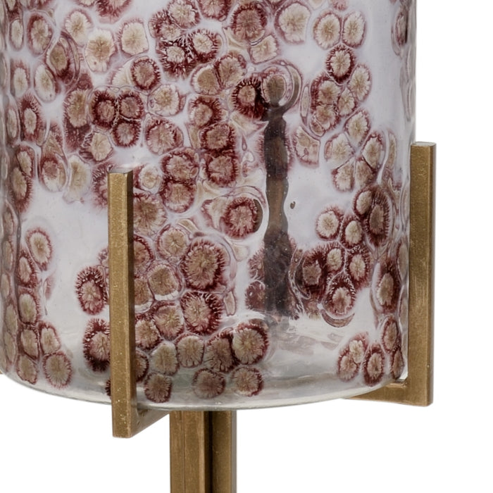 Decorative lamp with a textured brown and white shade on a gold base.