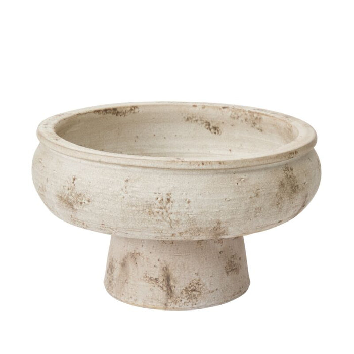 Ceramic bowl with a textured surface on a white background