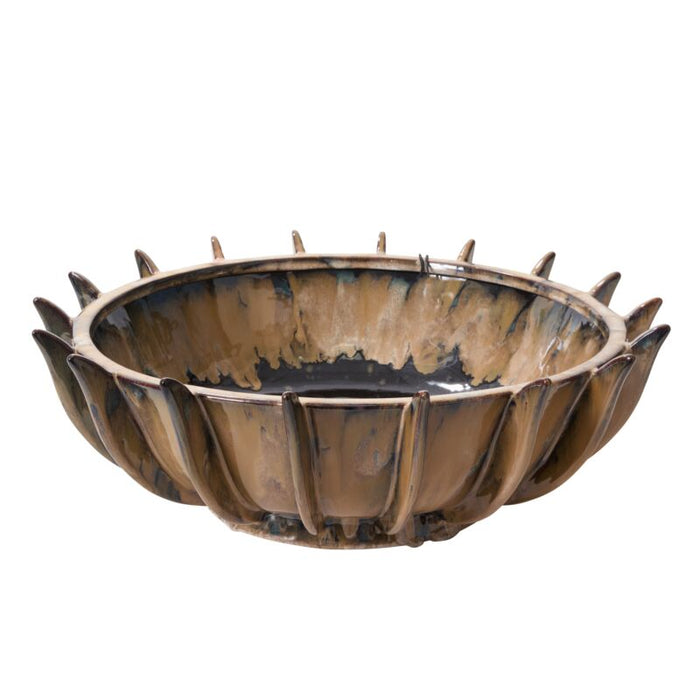Decorative metal bowl with spikes on a white background