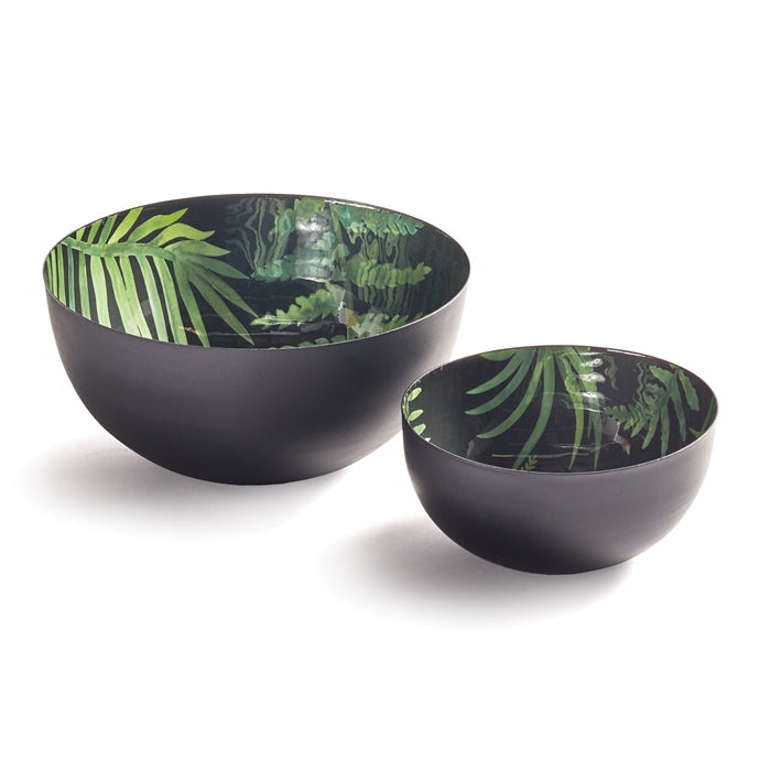 Two black bowls with green leaf patterns on a white background