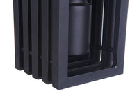Carmel outdoor wall mount frame in textured black with stacked vertical slats surrounding a cylindrical light housing