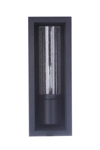 Textured Black outdoor wall mount with a cylindrical glass shade and lantern-like fixture mounted in a rectangular backplate.