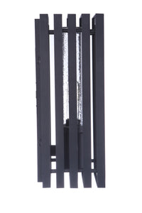 Textured black outdoor wall mount with vertical slats surrounding a glass-encased bulb, mounted frame in a rectangular