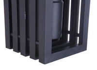 Textured black outdoor wall lantern with stacked rectangular frame slats, mounted around a cylindrical light element.