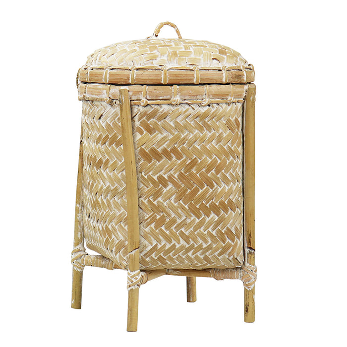 Woven rattan laundry basket with a lid on a white background