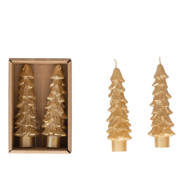 Two unscented beige tree-shaped taper candles in a brown box; one pair outside shows intricate layered tree design on