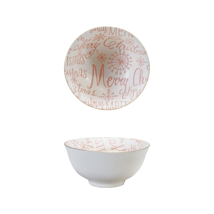 A stoneware bowl with a gold color rim and 'Merry Christmas' text on it, with a pink and white design.