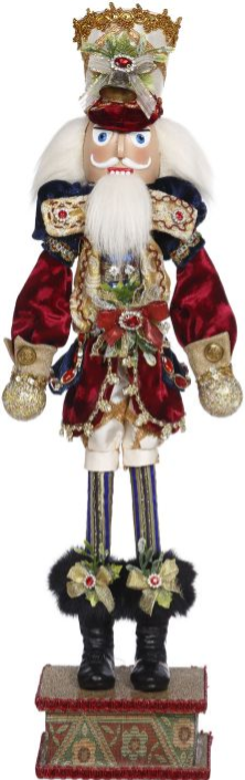 Tall nutcracker figure in ornate red velvet coat with gold trim, white beard, crown, and decorative belt, standing on